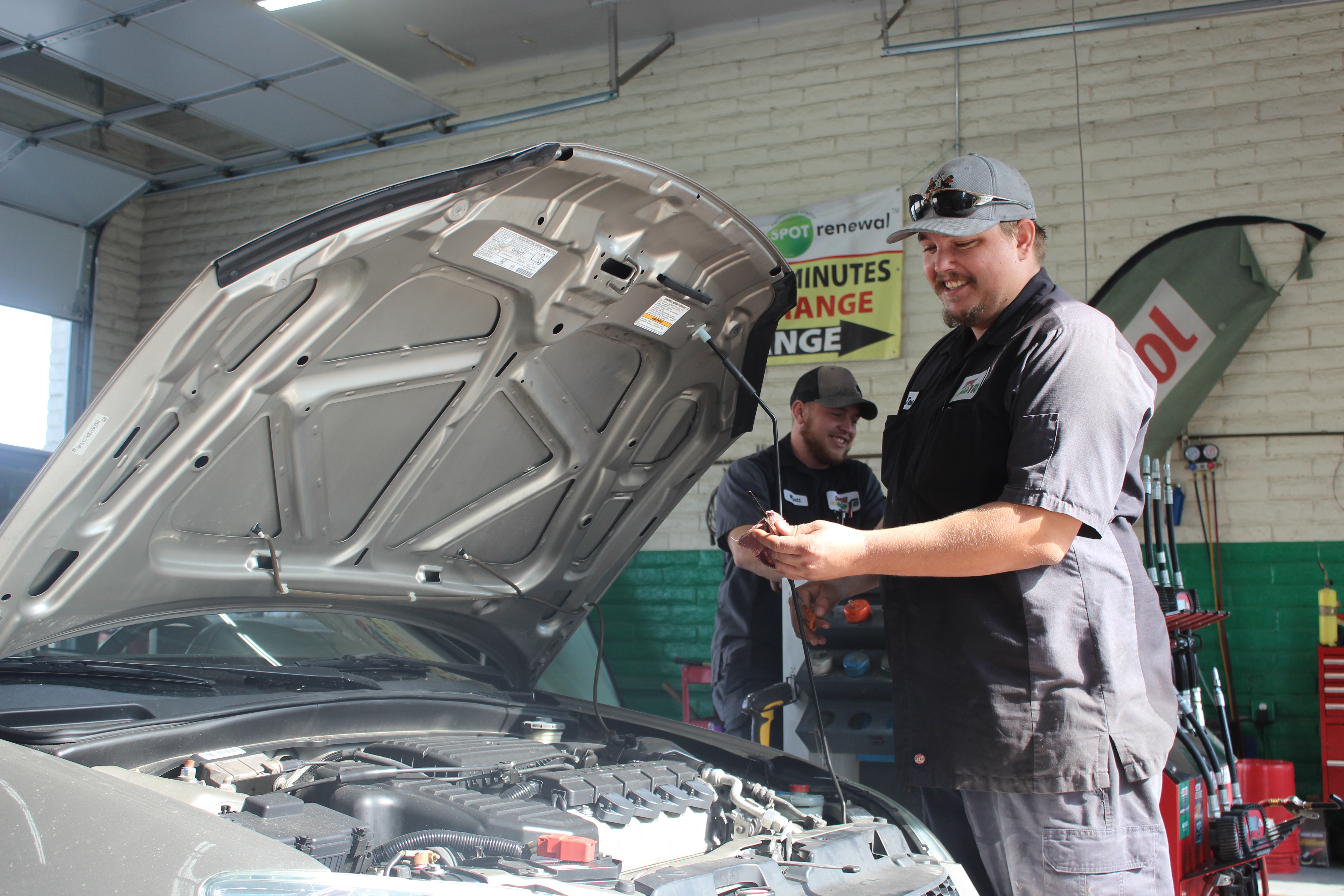 Staff working on a car | Grease N Go